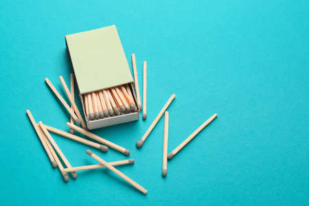 Box with matches on color backgroundの写真素材