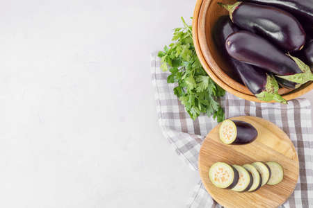 Composition with fresh eggplants on light backgroundの写真素材