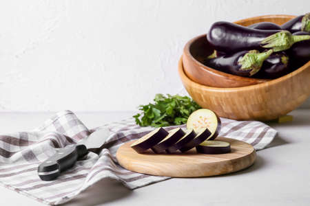 Composition with fresh eggplants on light backgroundの写真素材