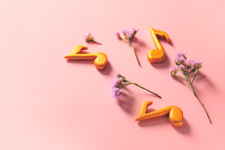 Music notes and flowers on color backgroundの写真素材