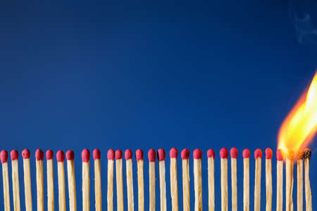 Burning and whole matches on color backgroundの写真素材