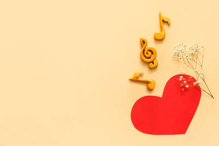 Music notes and red heart on color backgroundの写真素材