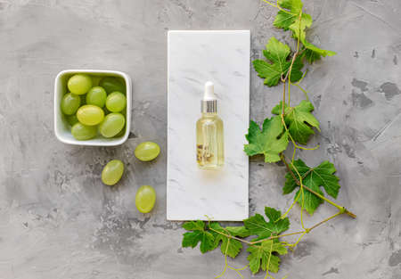 Bottle of grape seed oil on grunge backgroundの写真素材