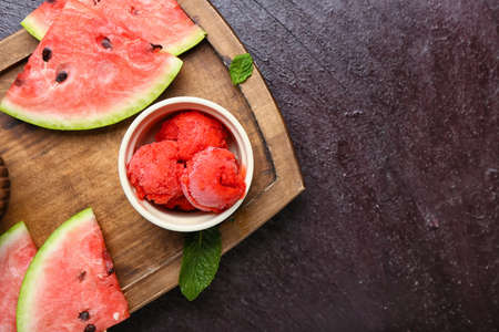 Bowl with watermelon ice cream on color backgroundの写真素材
