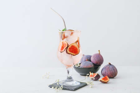 Composition with tasty fig lemonade on light backgroundの写真素材