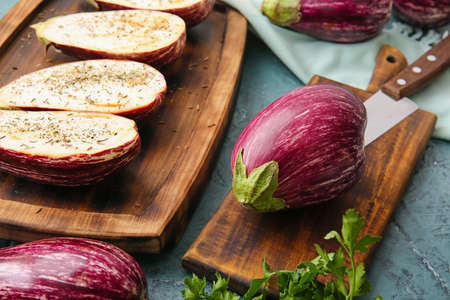 Fresh eggplants on color background