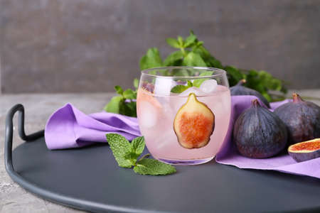 Composition with tasty fig lemonade on grunge backgroundの写真素材