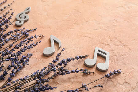 Flowers with music notes on color backgroundの写真素材