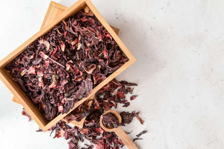 Composition with dry hibiscus tea on tableの写真素材