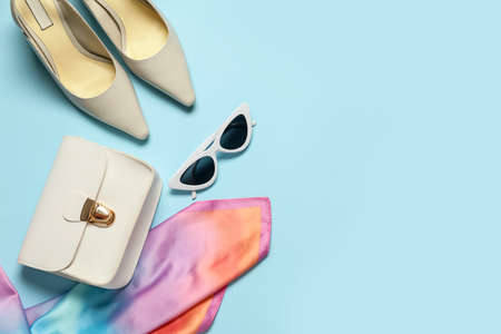 Set of female accessories and sunglasses on color backgroundの写真素材