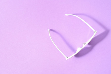 Stylish sunglasses on color backgroundの写真素材