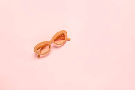 Stylish sunglasses on color backgroundの写真素材