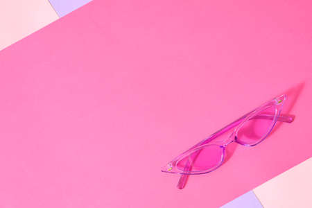 Stylish sunglasses on color backgroundの写真素材