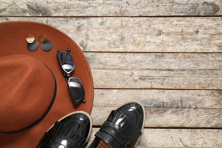 Set of female accessories and sunglasses on wooden backgroundの写真素材