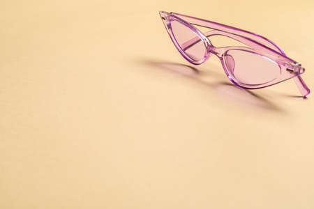 Stylish sunglasses on color backgroundの写真素材