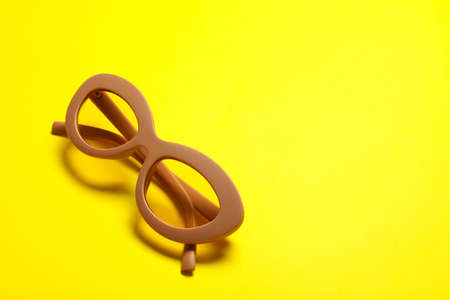 Stylish sunglasses on color backgroundの写真素材