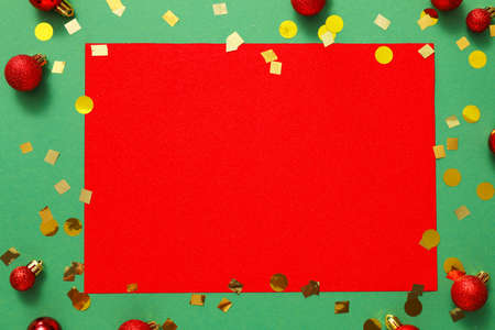 Beautiful Christmas decorations with empty card on color backgroundの写真素材