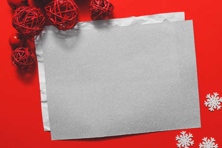 Beautiful Christmas decorations with empty card on color backgroundの写真素材