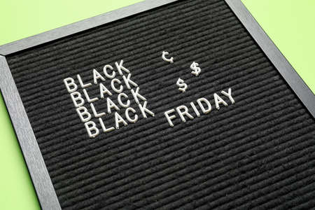 Board with text BLACK FRIDAY, closeup