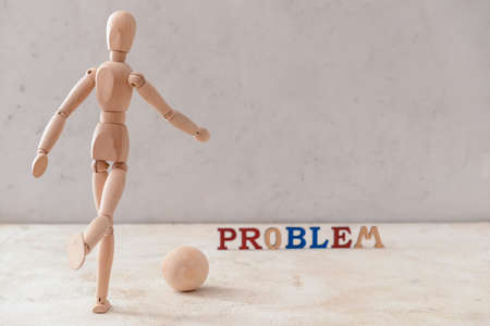 Wooden mannequin with ball and word PROBLEM on light backgroundの写真素材