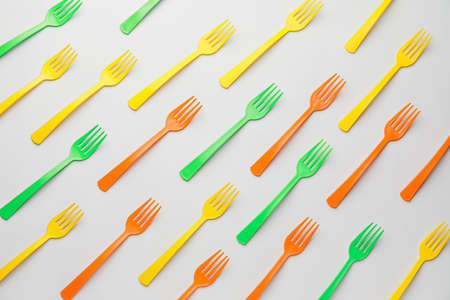 Plastic forks on light backgroundの写真素材