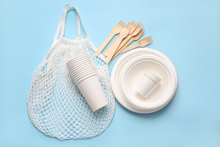 Eco tableware and bag on color backgroundの写真素材