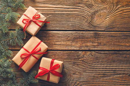 Beautiful Christmas gifts on wooden background