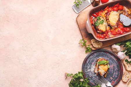Dish of tasty baked vegetables on color backgroundの写真素材
