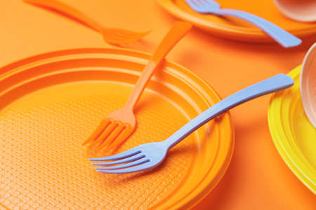 Plastic tableware on color background, closeupの写真素材