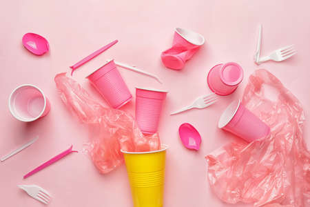 Plastic garbage on color backgroundの写真素材