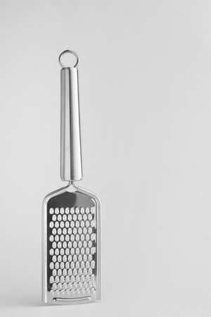 Metal grater on light backgroundの写真素材