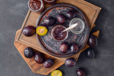 Composition with delicious homemade plum jam on dark backgroundの写真素材