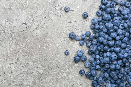 Tasty ripe blueberry on gray backgroundの写真素材