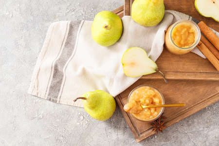 Tasty pear jam on grunge background