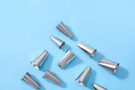 Different piping tips on color background