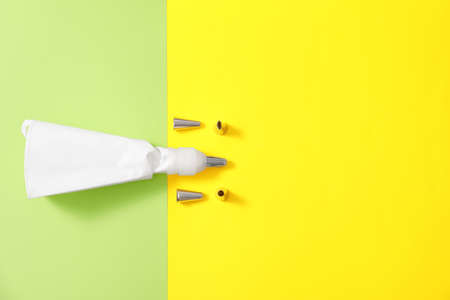 Pastry bag and different tips on color backgroundの写真素材