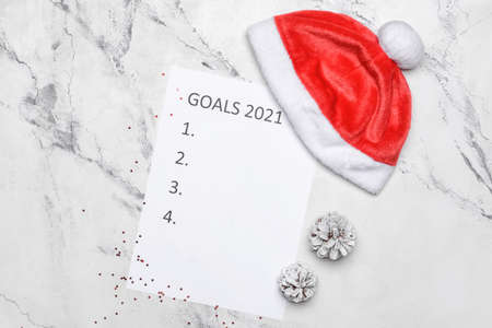 Empty to do list on 2021 year with Santa Claus hat on white backgroundの写真素材