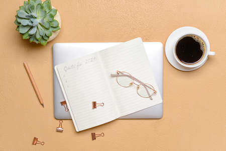 Empty to do list on 2021 year with laptop on color background