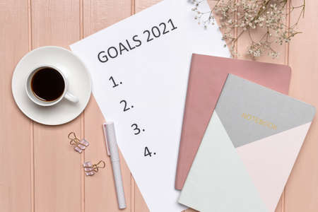To do list on 2021 year with cup of coffee on color wooden backgroundの写真素材