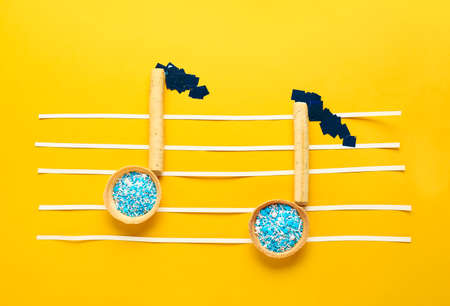 Music notes made of food on color backgroundの写真素材
