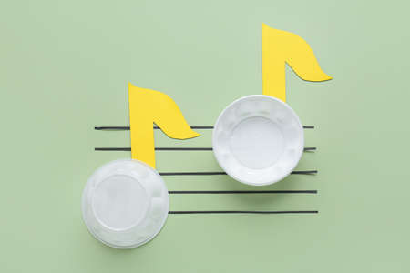 Music notes made of plastic plates on color backgroundの写真素材