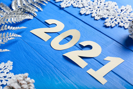New Year composition with figure 2021 on color wooden backgroundの写真素材
