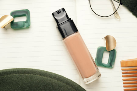 Bottle of makeup foundation and accessories, closeupの写真素材