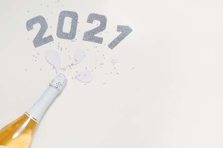 Christmas composition with bottle of champagne on white background