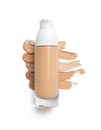 Bottle of makeup foundation and samples on white background