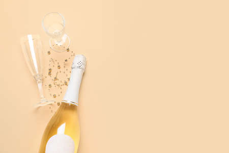 Christmas composition with bottle of champagne on color backgroundの写真素材