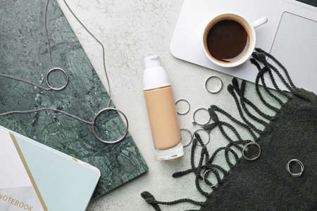 Bottle of makeup foundation and accessories on light backgroundの写真素材