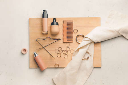 Bottles of makeup foundation and accessories on light backgroundの写真素材