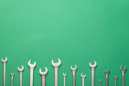 Set of metal wrenches on color backgroundの写真素材
