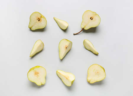 Fresh cut pears on light background